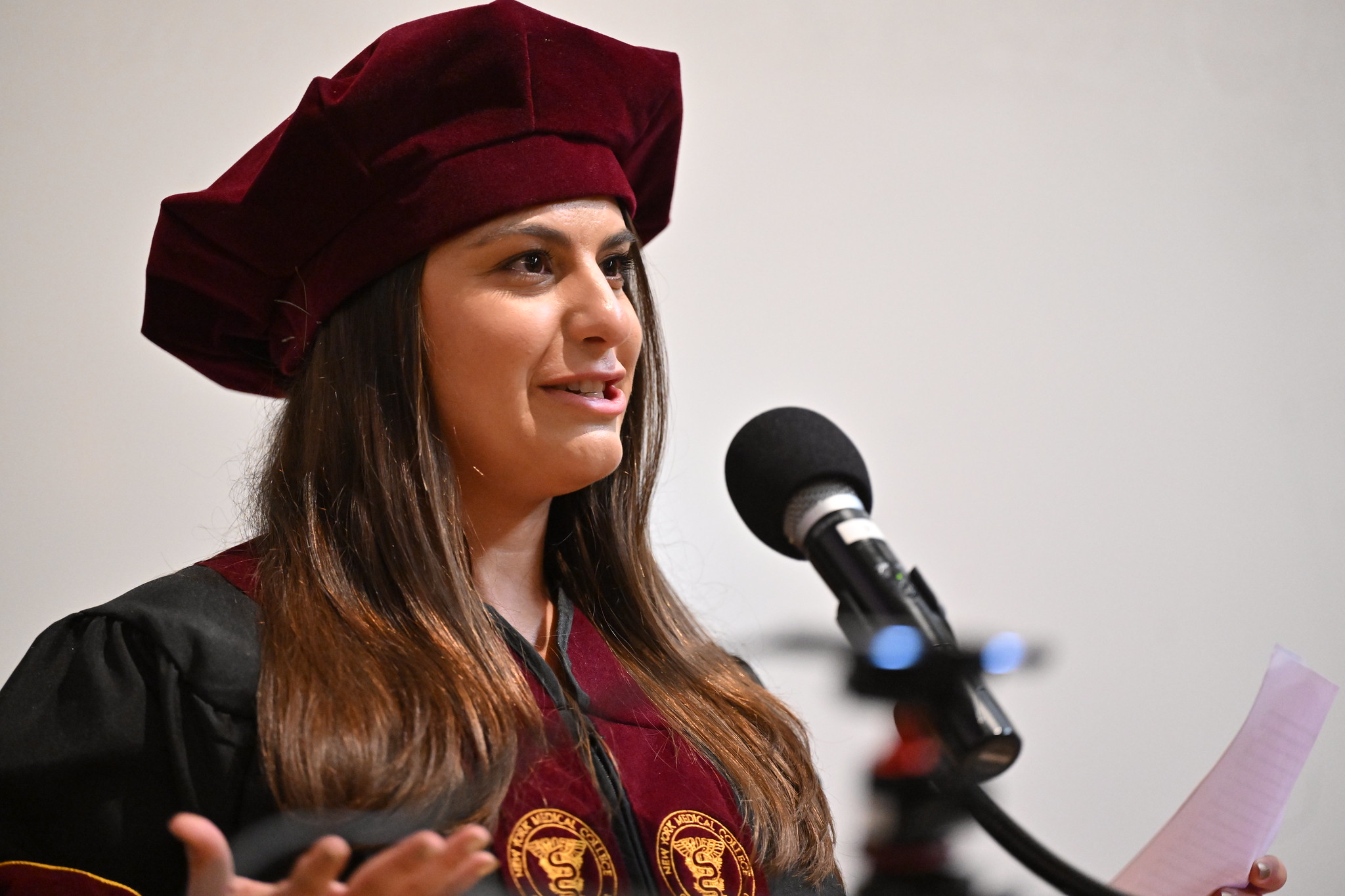 Tara Jarboe, M.S. ‘19, Ph.D. ‘24, at the podium giving the student commencement speaker speech. 